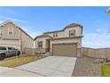 Charming two-story home featuring a two-car garage, well-kept lawn, and inviting curb appeal at 13446 Amber Sky St, Parker, CO 80134