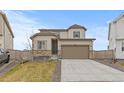 Attractive two-story house with a two-car garage, beautiful stone accents, and a cozy front yard at 13446 Amber Sky St, Parker, CO 80134