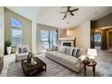 Bright living room features a sliding glass door, fireplace, and comfortable seating at 3250 E 103Rd Pl # 805, Thornton, CO 80229