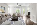 Bright living room with stylish furniture and hardwood floors at 12714 E Dickenson Ave, Aurora, CO 80014