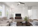 Inviting living room featuring recessed lighting and modern decor at 12714 E Dickenson Ave, Aurora, CO 80014