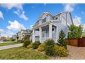 Beautiful home with inviting porch and landscaped yard, located in a desirable neighborhood with tree-lined streets at 713 San Juan Dr, Lafayette, CO 80026