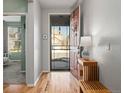 Bright entryway with hardwood floors, leading to other rooms in the home at 8048 Grady Cir, Castle Rock, CO 80108