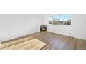 Spacious living room featuring a fireplace, hardwood floors, and plenty of natural light at 2644 Devonshire Ct, Denver, CO 80229