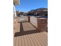 Inviting front porch made of composite wood, and brick railing perfect for relaxing outdoors at 6761 Meade Cir, Westminster, CO 80030