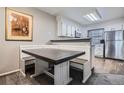 Cozy dining area adjacent to the kitchen with built-in booth seating at 1920 S Hannibal St # B, Aurora, CO 80013