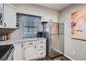 Bright kitchen features stainless steel appliances and ample cabinet space at 1920 S Hannibal St # B, Aurora, CO 80013