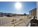 Spacious balcony with white railings, offering neighborhood views under a sunny sky at 2673 Live Oak Ct, Castle Rock, CO 80104