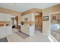 Spacious kitchen featuring stainless steel appliances, white cabinetry, and sleek countertops at 2673 Live Oak Ct, Castle Rock, CO 80104