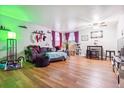 Spacious living room with hard surface flooring, modern furniture, and natural light at 3623 S Sheridan Blvd # T6, Denver, CO 80235