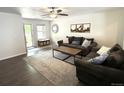 Inviting living room with ample seating and natural light at 7883 S Kalispell Cir, Englewood, CO 80112