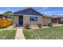Charming home featuring a well-kept lawn and a classic brick facade at 3685 Jasmine St, Denver, CO 80207