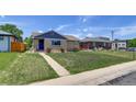 Charming home featuring a well-kept lawn and a classic brick facade at 3685 Jasmine St, Denver, CO 80207