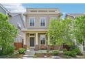 Charming two-story home with a welcoming front porch, offering a cozy and inviting curb appeal at 11346 E 27Th Ave, Denver, CO 80238