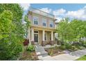 Charming home with a welcoming front porch and rooftop deck, surrounded by lush greenery at 11346 E 27Th Ave, Denver, CO 80238