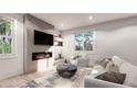 Modern living room with a fireplace, floating shelves, and plenty of natural light at 4024 Upham St, Wheat Ridge, CO 80033