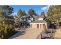 Charming two-story home with a three-car garage, landscaped front yard and inviting curb appeal at 8223 Kincross Way, Boulder, CO 80301