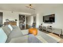 View of the living room, featuring contemporary furnishings, decor, and a work space at 1750 Wewatta St # 834, Denver, CO 80202