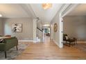 Bright hallway showcasing hardwood floors and an open floor plan with staircase at 2461 Spruce St, Denver, CO 80238