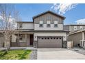 Charming two-story home with a well-kept lawn and inviting front porch at 10506 Akron St, Commerce City, CO 80640