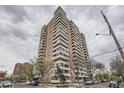 Tall high-rise building featuring multiple balconies and street views at 130 N Pearl St # 1001, Denver, CO 80203