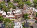 Beautiful aerial view of a neighborhood with tree-lined streets and attractive brick buildings at 2524 Champa St # 1, Denver, CO 80205