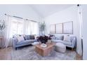 Spacious living room boasting natural light, with a comfortable sofa and stylish decor at 1431 Beacon Hill Dr, Highlands Ranch, CO 80126