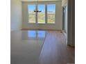 Kitchen island with quartz countertop, hardwood floors, and sliding doors leading to the backyard at 901 Coal Bank Trl, Castle Rock, CO 80104