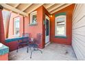 Cozy front porch featuring classic brickwork and comfortable seating area at 279 Delaware St, Denver, CO 80223