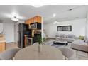 Open concept living area flows into kitchen and living room creating an inviting space at 7999 Chase Cir # 31, Arvada, CO 80003