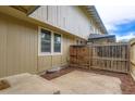 Private backyard featuring a wooden fence, concrete area, and convenient access; optimal outdoor space at 8759 E Roundtree Ave, Greenwood Village, CO 80111