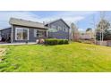 Expansive backyard with lush green lawn, perfect for outdoor entertaining and relaxation at 1413 Ben Nevis Ave, Broomfield, CO 80020