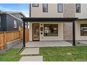 Inviting entrance featuring stylish door with wreath, covered porch, and modern design elements at 1423 Xavier St, Denver, CO 80204