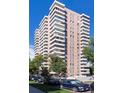 A modern high-rise apartment building with balconies and ample parking at 130 N Pearl St # 1804, Denver, CO 80203