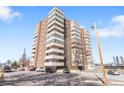 An impressive exterior view of a multi-story condo building with balconies and ample parking at 1888 S Jackson St # 604, Denver, CO 80210