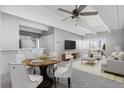 Open living space features dining area, modern furniture, and great natural light at 1888 S Jackson St # 604, Denver, CO 80210