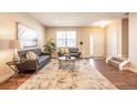 Spacious living room with hardwood floors and modern furniture at 821 Robert St, Longmont, CO 80503