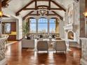 Bright living room featuring a fireplace, high ceilings, and large windows at 1880 Mallard Dr, Broomfield, CO 80020