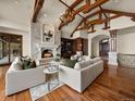 Cozy living room with fireplace, hardwood floors, and built-in shelving at 1880 Mallard Dr, Broomfield, CO 80020