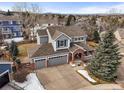Spacious two-story home with mountain views and a large driveway at 7065 Campden Pl, Castle Pines, CO 80108