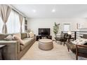 Bright living room featuring hardwood floors, stylish furniture, and an inviting atmosphere at 1045 W 101St Ave, Northglenn, CO 80260