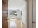 Inviting living room featuring hardwood floors, bright windows and lots of natural light at 1130 N Pennsylvania St # 208, Denver, CO 80203