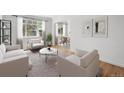 Bright living room with stylish furnishings, neutral tones, and views of outside greenery at 1130 N Pennsylvania St # 208, Denver, CO 80203
