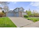 Attractive home with a two-car garage and a well-maintained lawn and a spacious driveway at 907 Eldorado Dr, Superior, CO 80027