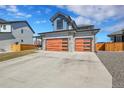 Beautiful two-story home with a three car garage and a well-maintained lawn at 804 Spyglass Cir, Louisville, CO 80027