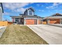Beautiful two-story home with a three car garage and a well-maintained lawn at 804 Spyglass Cir, Louisville, CO 80027