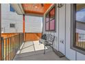 Inviting covered porch area with ceiling fan, seating and views of the neighborhood at 804 Spyglass Cir, Louisville, CO 80027
