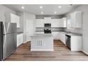 Modern kitchen featuring stainless steel appliances and granite countertops at 2244 Alyssa St, Fort Lupton, CO 80621