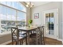 Bright dining area with large window views and a stylish light fixture at 18669 Stroh Rd # 10208, Parker, CO 80134