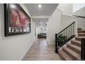 View of the entryway with a modern staircase and large artwork at 1161 E Witherspoon Dr, Elizabeth, CO 80107